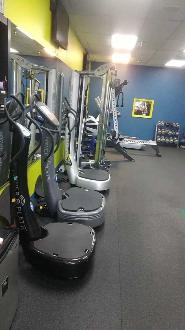 Row of Power Plate vibration training machines in a personal training studio in Arlington Heights.